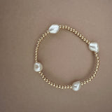 4mm gold filled bracelet w/ 4 white pearls